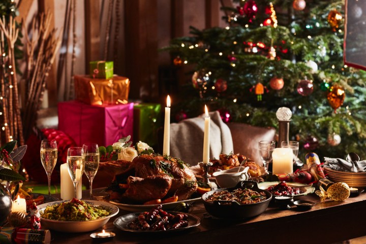 a plate of food and glasses of wine on a table
