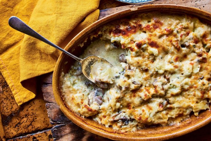 a slice of pizza sitting on top of a wooden table