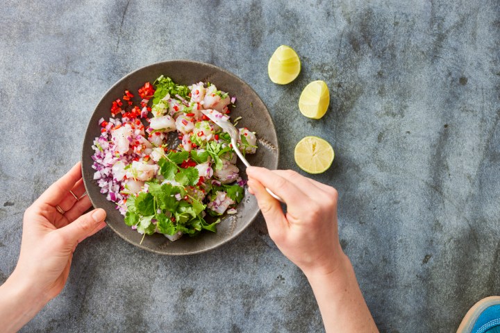 a person holding a bowl of food