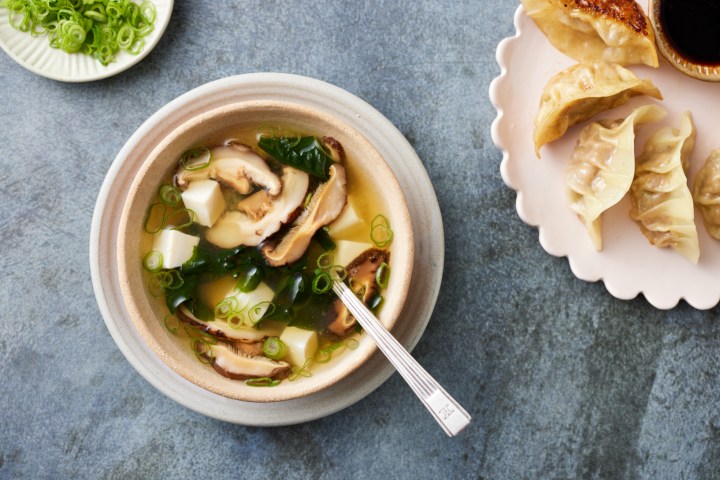 a bowl of food sitting on a table
