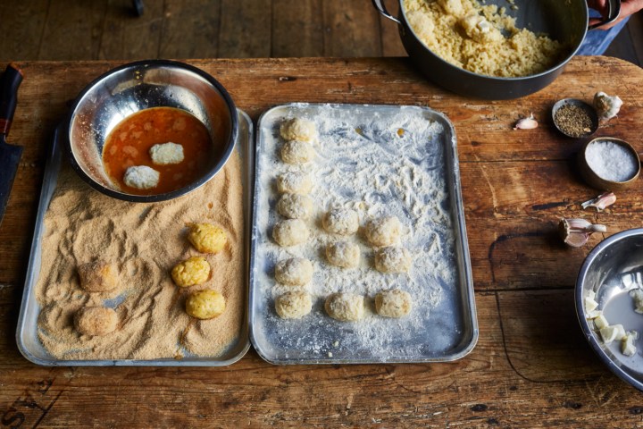 a bowl of food on a wooden table
