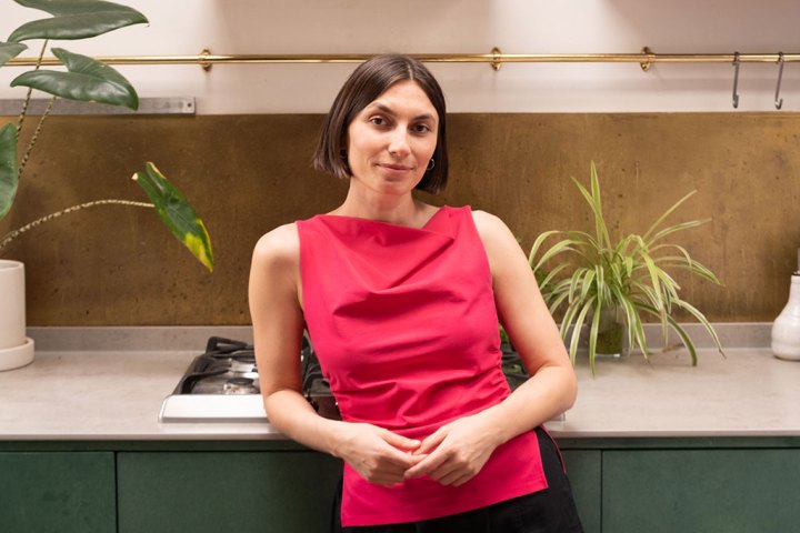a woman standing in a kitchen