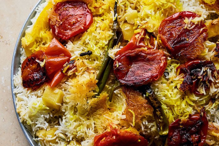 a close up of a plate of saffron rice